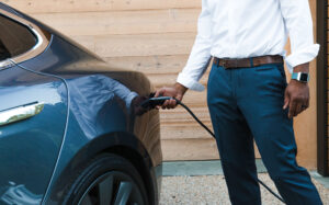 Man charging electric car